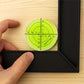 Bulle à niveau circulaire avec cadre photo noir - alignement parfait pour accrochage mural