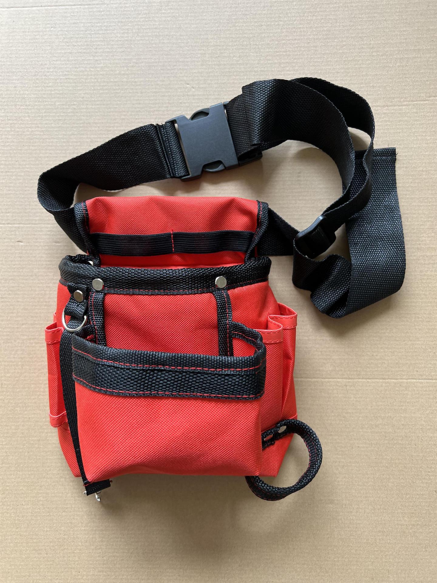 Sac à outils pour taille rouge avec bandes noires, ceinture ajustable et boucle de fixation