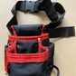 Sac à outils pour taille noir avec bandes rouges, ceinture ajustable et boucle de fixation