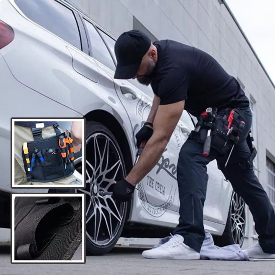 Mécanicien automobile portant un sac à outils pour taille noir avec outils rouges, travaillant sur une jante de voiture